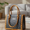 elegant black tote bag with white line pattern & dual tone straps