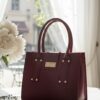 maroon structured handbag maroon structured handbag